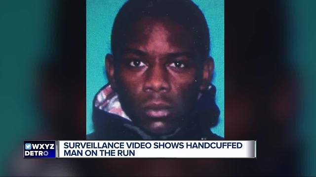 Surveillance video shows handcuffed man on the run
