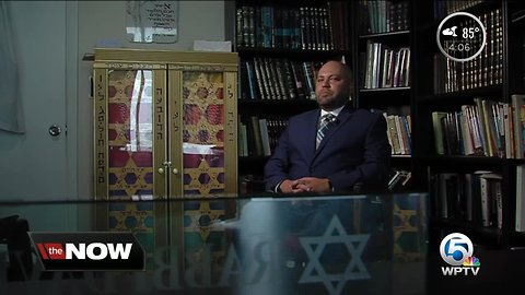 Boynton community members standing in solidarity at synagogue