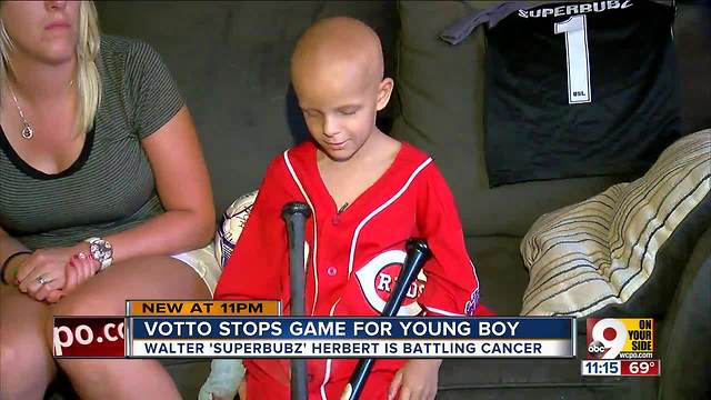 Joey Votto stops game for young fan with cancer