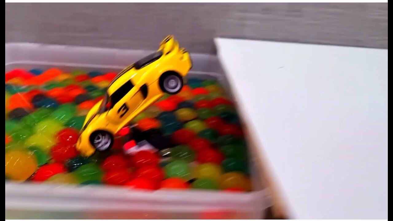 diecast cars crashing into floating balls various