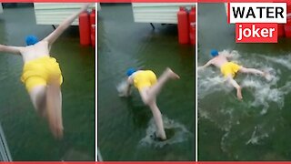 Holidaymaker jumping into floodwater