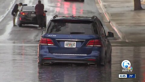 Cars swamped on Banyan Blvd. in West Palm Beach