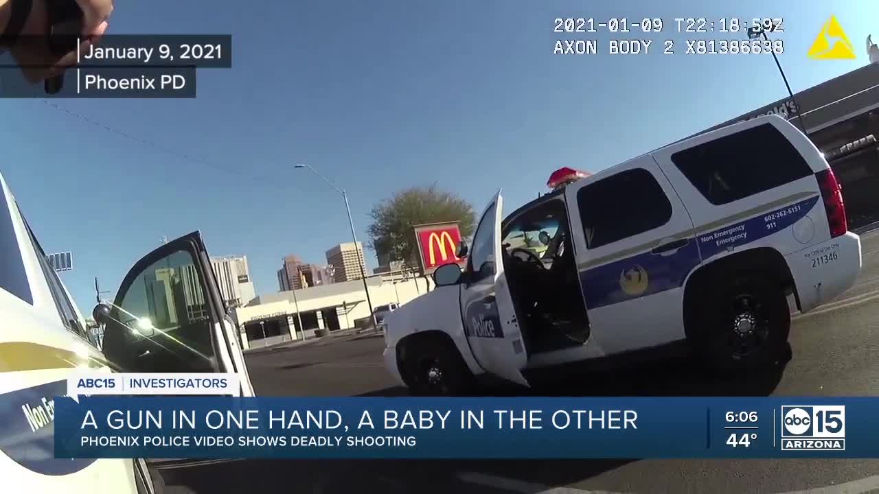 Phoenix police release video of a man shot while holding a baby