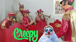 Creepy Paper Mache Mannequin band at antique circus exhibit.