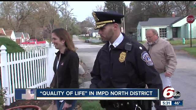 Police officers meet with residents to help them address quality of life issues