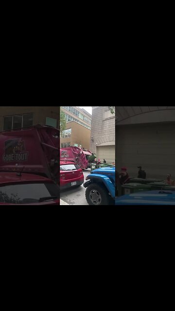 Trash collector in busy downtown