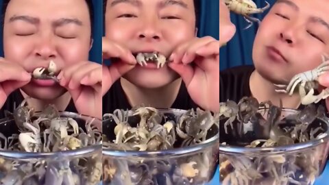 Hungry man and live crabs