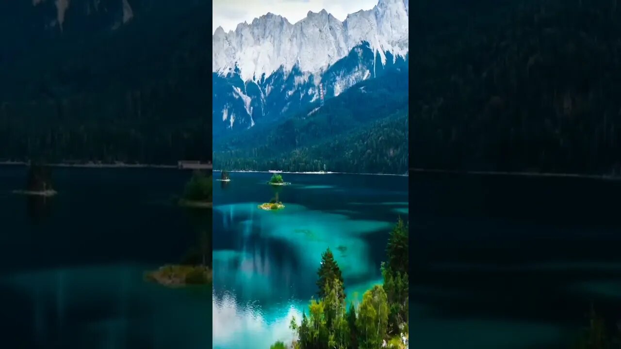 The beautiful Eibsee lake with crystal clear water is located on the border of Germany and Austria..