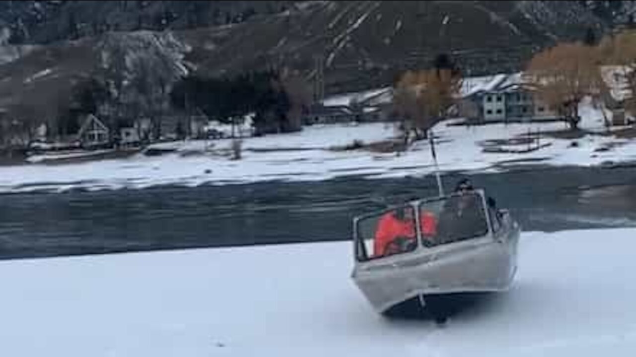 Boat slides across snow between two lakes!