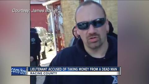 Racine officer accused of stealing money from dead man