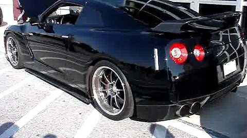 Modified GT-R and crazy guy in a godzilla outfit!