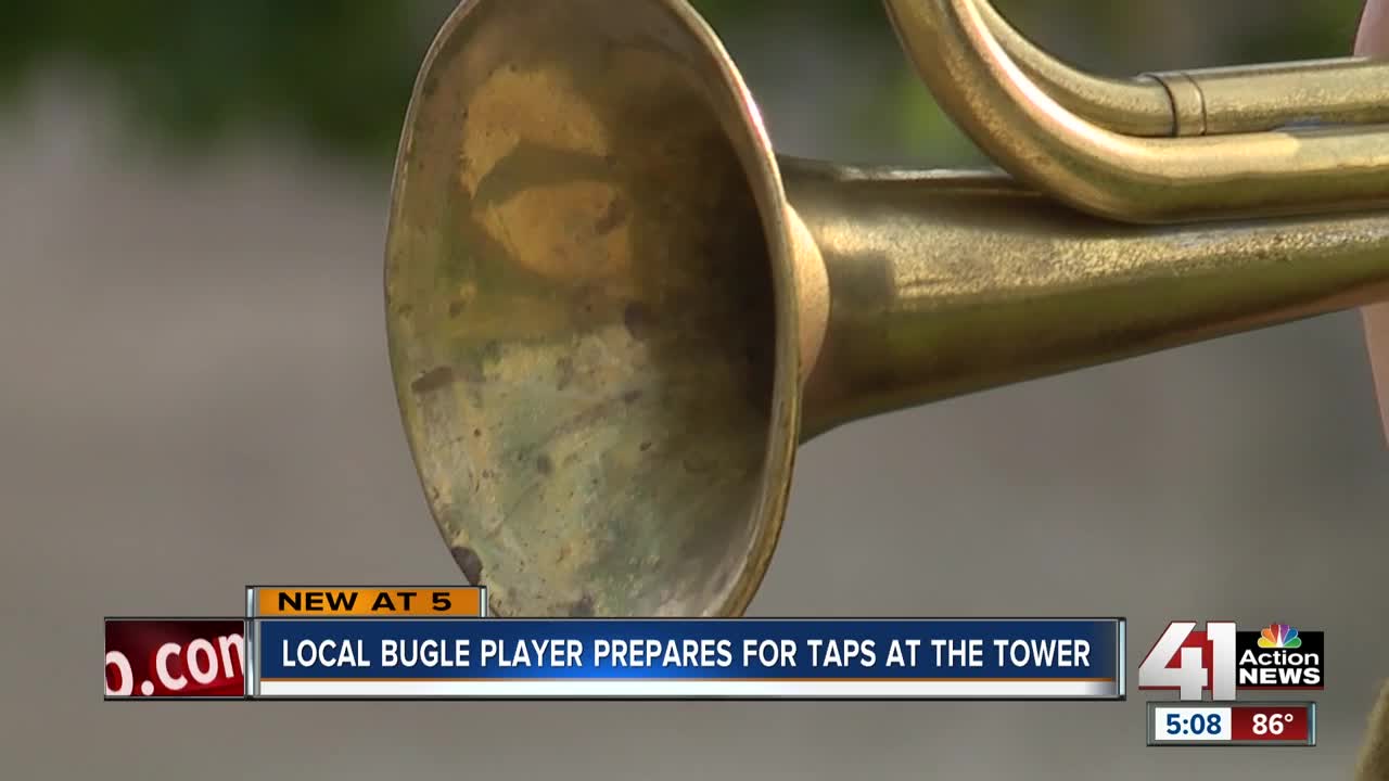 Local bugle player prepares for Taps at the Tower