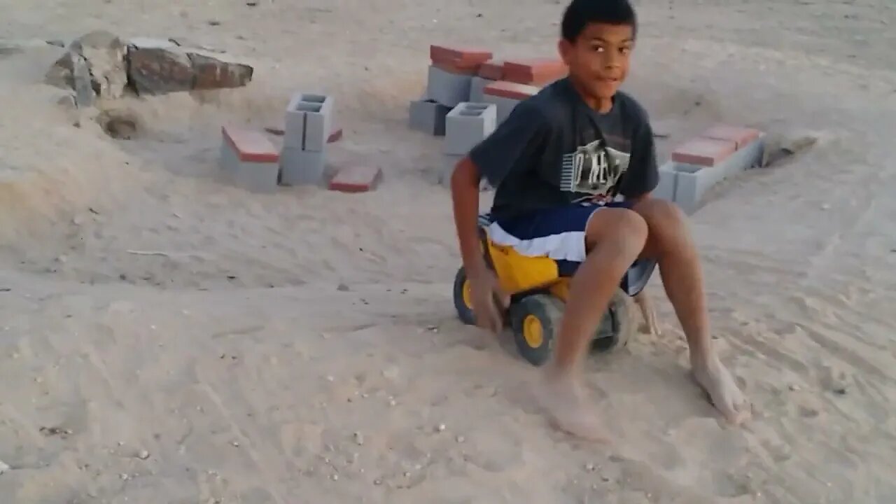 Toby Rolls down a Hill on a Toy Truck