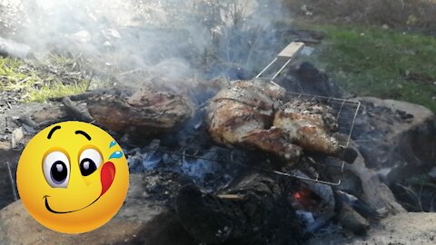 Grill chicken over charcoal