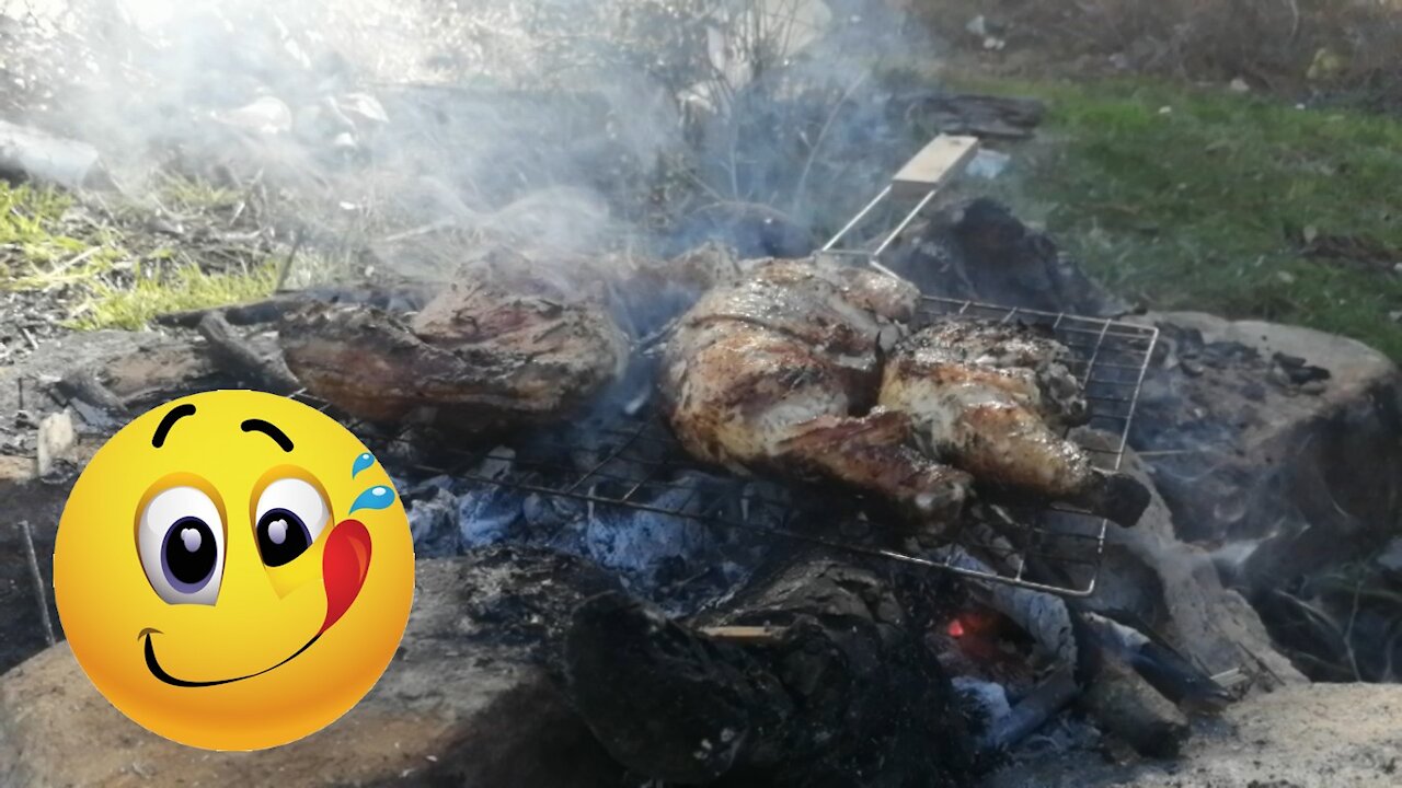 Grill chicken over charcoal