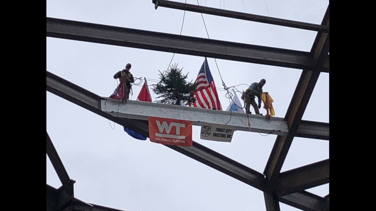 Crews raise the final steel beam to mark project milestone at The QCrews raise the final steel beam to mark project milestone at The Q
