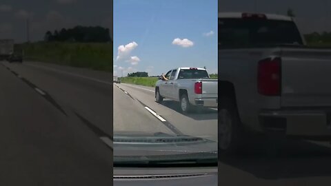 Guy driving with foot out the window