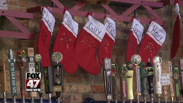 Santas needed to have fun while giving back during SantaCon on Monday