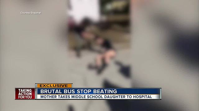 School officials investigating after video shows fight between middle school students at bus stop