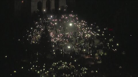 Denver protesters create light in darkness at the Colorado State Capitol to honor George Floyd