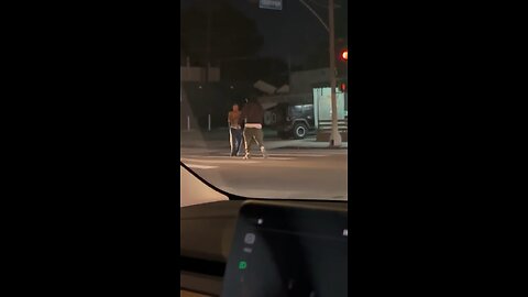 Guy wacks vagrant in the head with pole blocking traffic in LA.