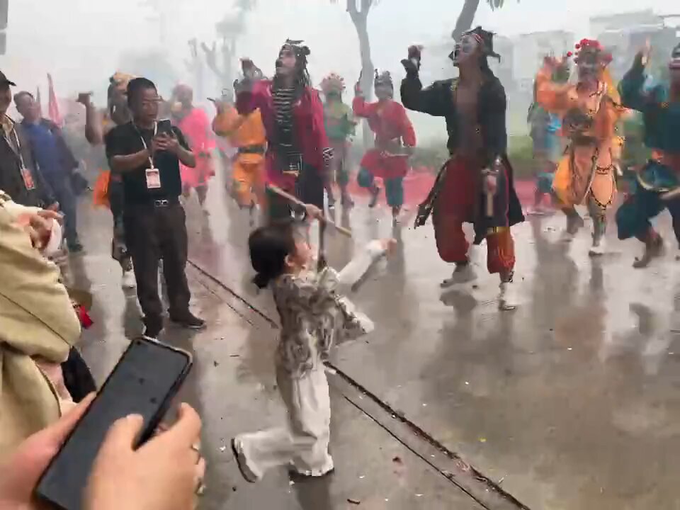 Check out this spirited 5 y.o. girl local Yingge dance team at a parade in Shantou, Guangdong, China