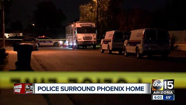 Police surround Phoenix home overnight