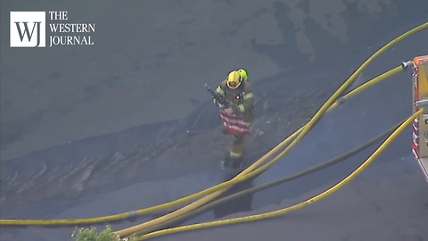 Firefighters Spot American Flag In Burning Building, Fight Through Flames To Save Old Glory