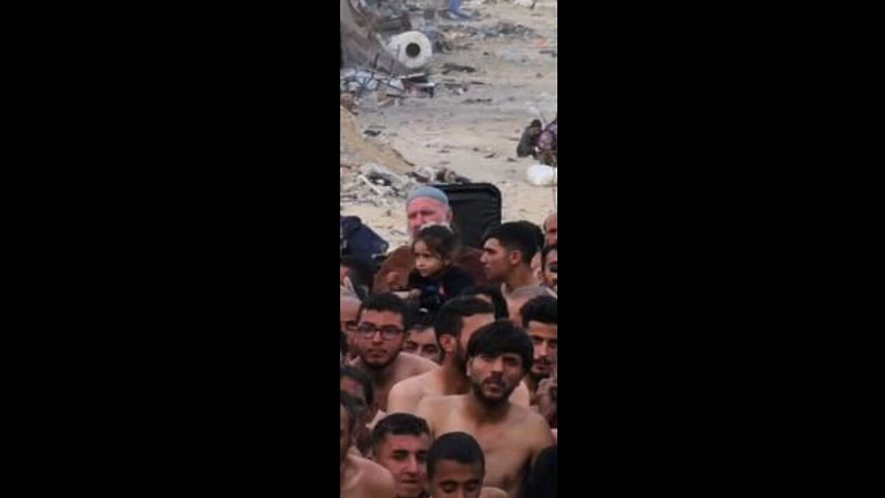 small girl in this photo Detained by Israeli occupation forces amongst 100s of half undressed men.