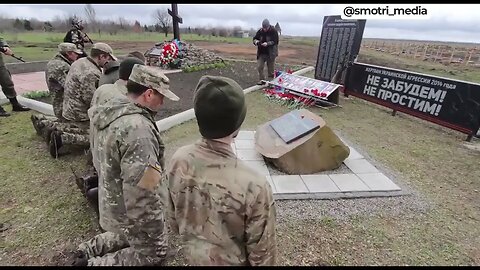 War Footage: Ukrainian Soldiers made to kneel in front of children’s graves in Donbass