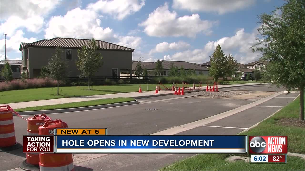 Crews working to fill depression in popular new Pasco County development