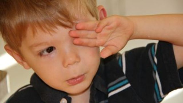 Boy gets an eye exam for the first time.