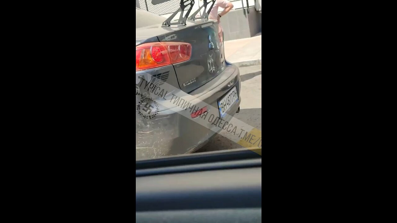 Ukraine military in a civilian car with Nazi symbols driving around Odessa