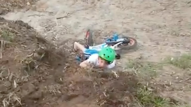 Young Dirt Biker Loses Balance And Face Plants On The Ground