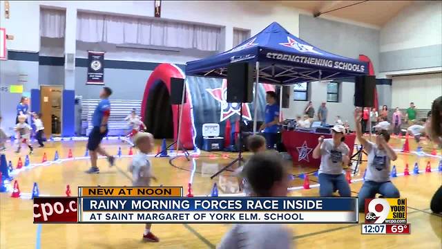 Rainy morning forces race inside