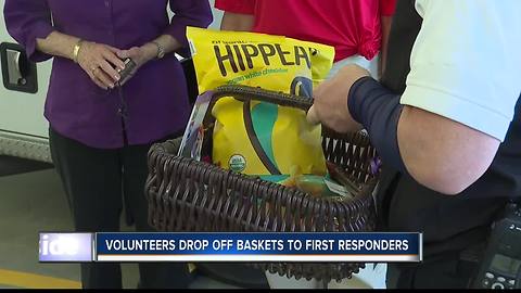 Volunteers drop off goody baskets to first responders