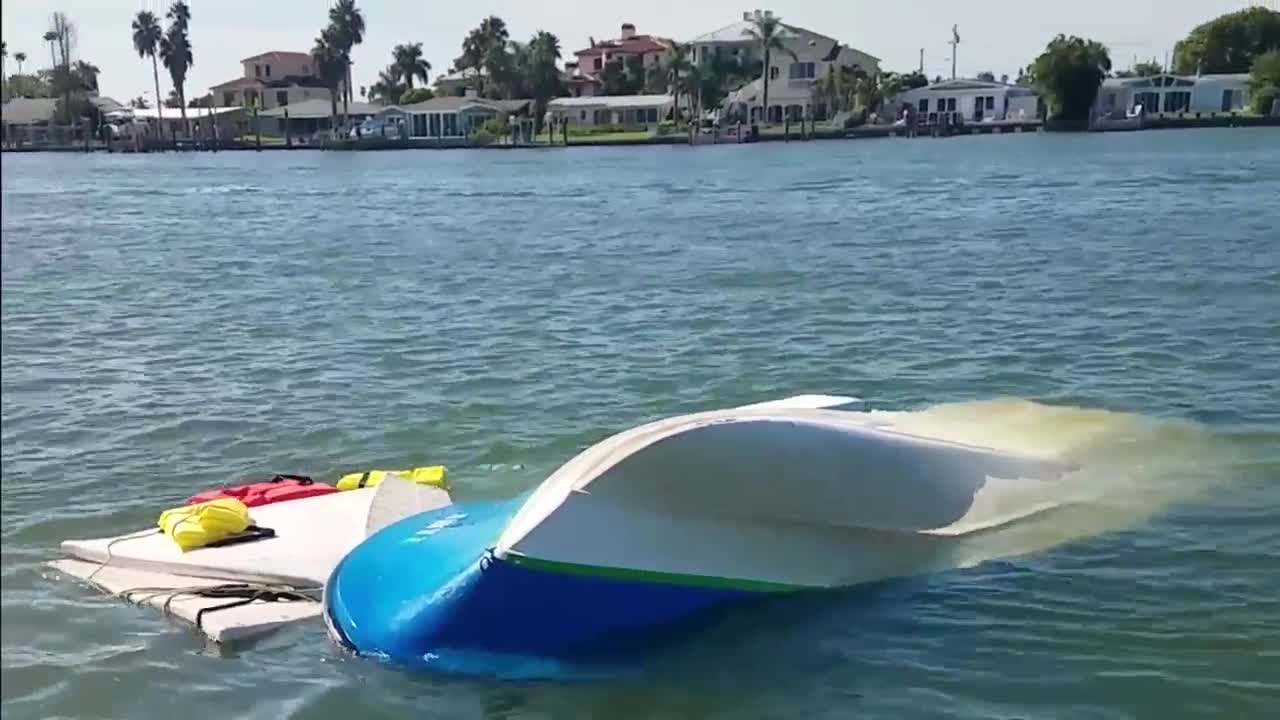 Video shows off-duty Coast Guard pilot rescues two people in water near John's Pass