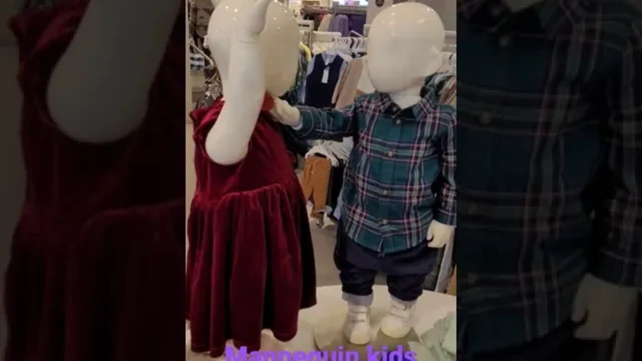 mannequin kids posing in the store.