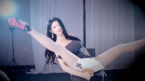 Sexy pole dancer in a high-slit skirt, long legs, splits, nude stockings, heels, with an intense expression