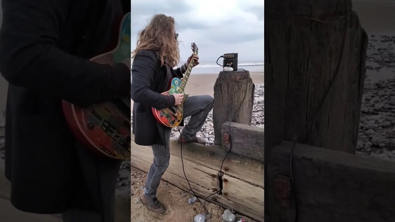 Playing Guitar At The Beach