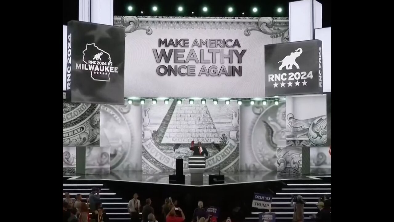 The pyramid backdrop with the eye of Horus at TRUMP RNC Rally) 👁