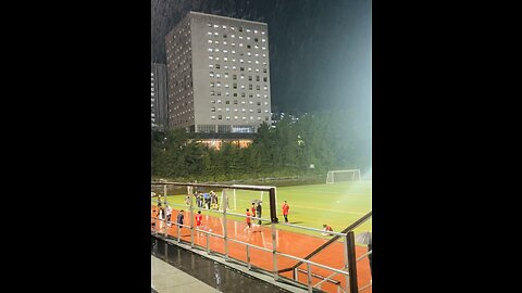 Football match in rainy weather