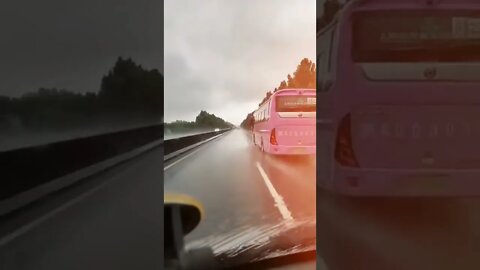 Hi Speed Bus on Wet Road
