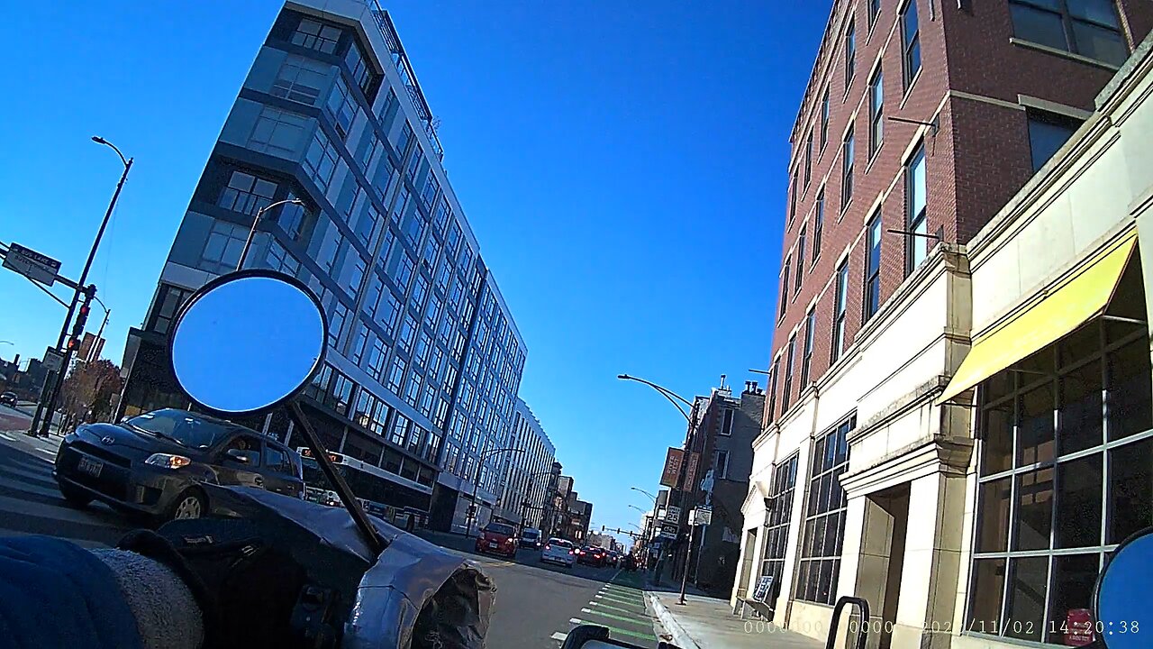 Bad driver blocking bike lane and other driver not going on the green arrow