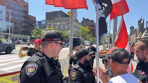 Ottawa Police call in Power happy Bylaw officer to remove banners protesting the Prime Minister.