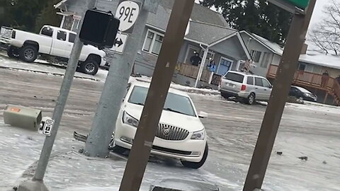 Winter storm in Oregon causes people and cars to slide down icy hill