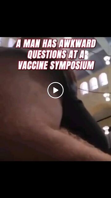 A MAN HAS AWKWARD QUESTIONS AT A VACCINE SYMPOSIUM