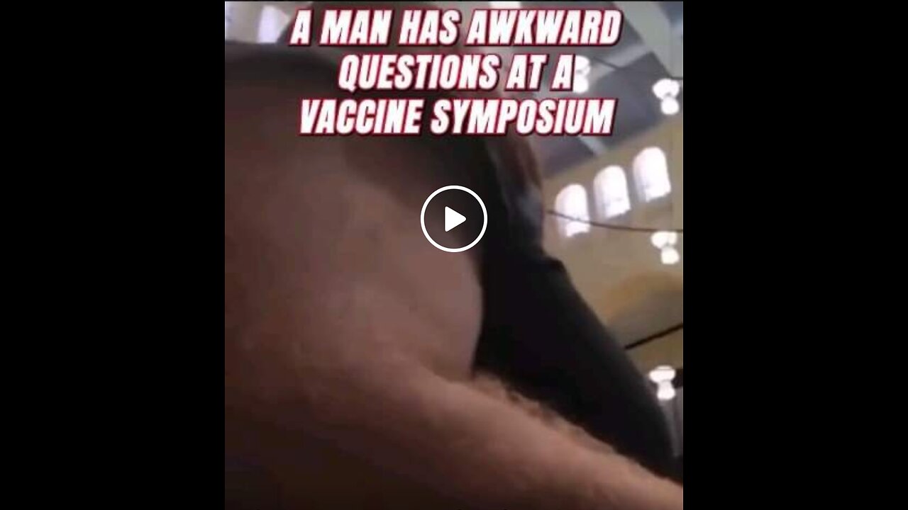 A MAN HAS AWKWARD QUESTIONS AT A VACCINE SYMPOSIUM