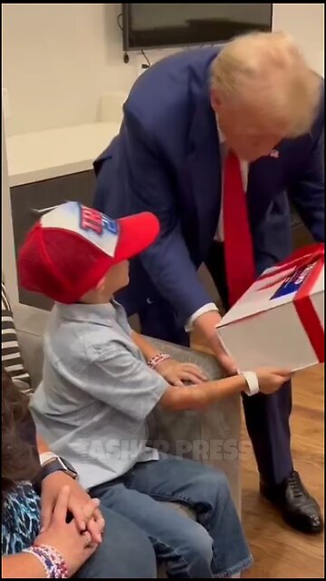 Trump gifts Liam, a boy with a brain disease, before a rally in New York