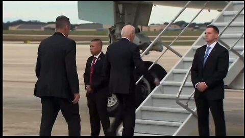 Biden boards the short bus plane ✈️ but where is our military to greet him…WAKE UP!!!